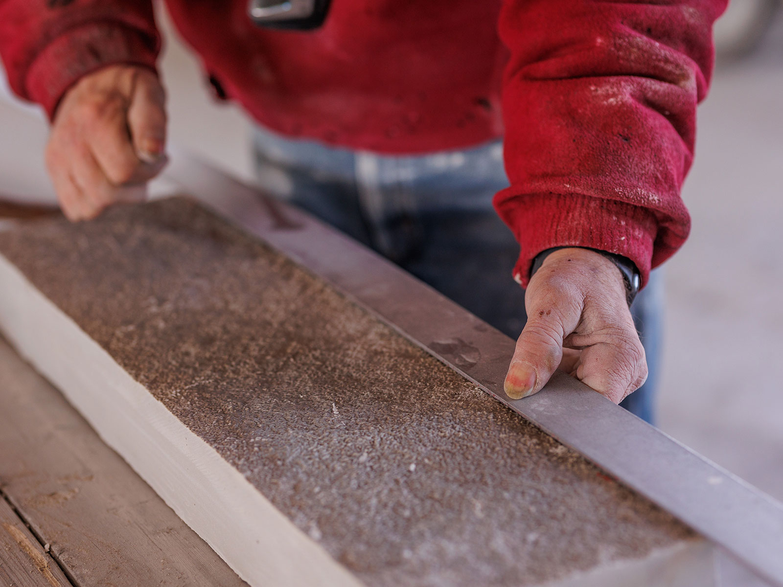 A stone mason measuring stone from the Rademann Stone quarry